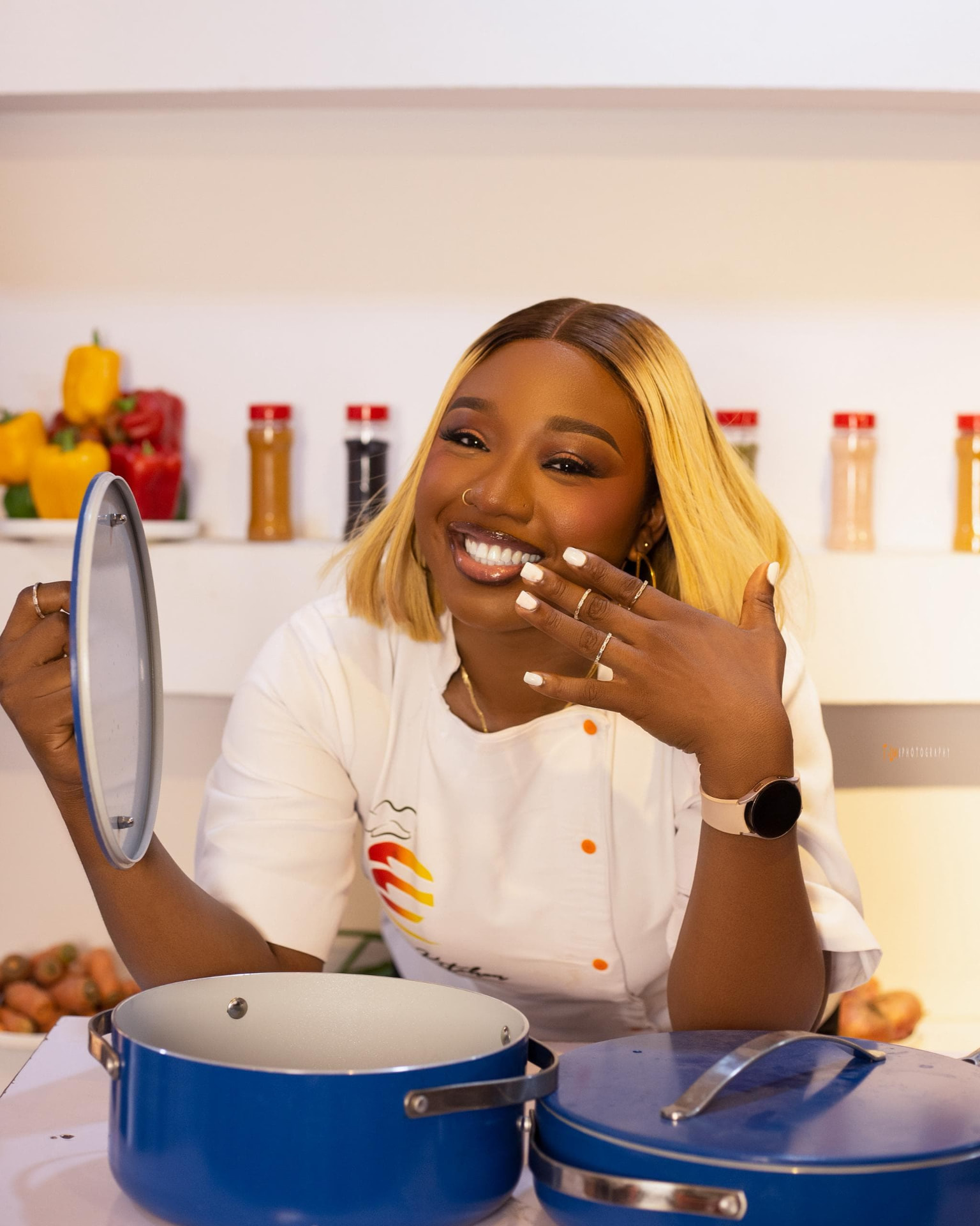 Ennie, founder and chef of Ennieskitchen, wearing chef whites.